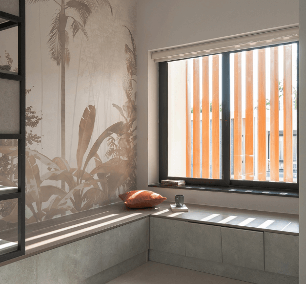 A room featuring a window and a seating arrangement