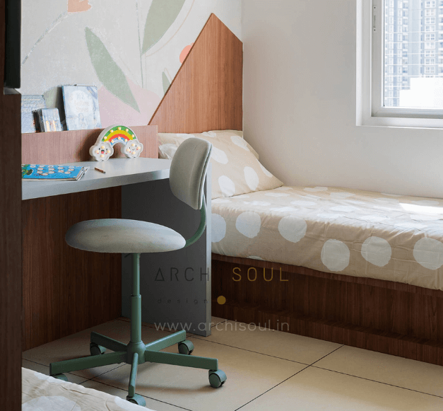 A small kids room featuring a desk and a bed, with minimal decor